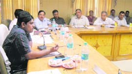 Ajit Joshi (left), DC, at a district-level review committee meeting.