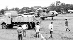 An IAF chopper (MI-17) brings in ration for villagers at Pasighar in Arunachal Pradesh