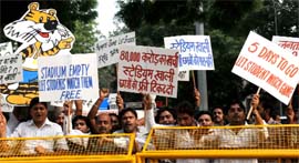 BJP leader Vijay Goel with party activists protests at CWG office, demanding free tickets to students for the Commonwealth Games events, in New Delhi on Friday.