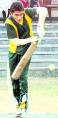 A batsman defends a delivery at the Inter-School Boys Super 8s Cricket Tournament in Dehradun on Friday