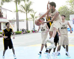 Players of Welham Boys School and Hilton School in action at the XIth Inter-School Frank Anthony Basketball Tournament in Dehradun on Friday