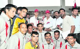 Athletes pose with their trophies and medals after the conclusion of the 8th Inter-District Police Athletics Meet in Dehradun on Friday