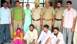 The police with four accused in Sirsa on Friday.