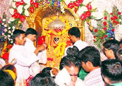 Devotees offer prayers at Kali Mata Mandir in Jammu on Friday