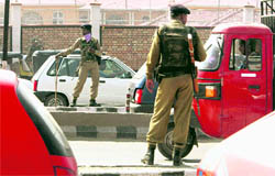 Security personnel keep vigil on a street in Srinagar on Friday