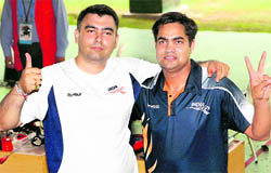 Gagan Narang and (R) Imran Hasan, gold medal-winning marksmen