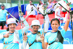 Indian women archers Deepika Kumari, Bombayala Devi Laishram and Dola Banerjee celebrate after winning gold in womens team recurve in New Delhi on Friday