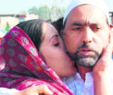 A Haj pilgrim gets a warm send-off from a relative in Srinagar on Saturday.