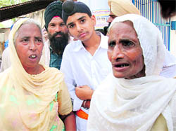 Jasbir Kaur (left) and Piar Kaur, daughter and wife, respectively, of Ranjit Singh, in Bathinda on Saturday