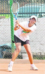 A player in action during the North Zone CBSE Lawn Tennis Tournament in Chandigarh on Sunday.