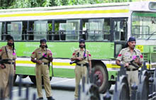 Police personnel guard Connaught Place during the cycling events in New Delhi on Sunday.