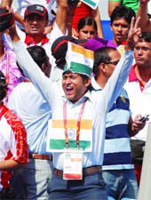 Archery supporters celebrate Indias good show in  men's and womens individual recurve events at the Yamuna Sports Complex in New Delhi on Sunday.