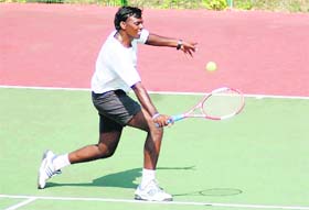 A player makes a return at the Veterans Tennis Tournament in Dehradun