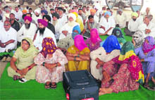 Farmers attend the mahapanchayat organised by Gorakhpur farmers in Fatehabad on Sunday. 