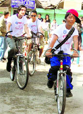 Riders participate in a cycle rally at McLeodganj on Sunday