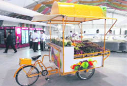 The fruit cart, built in Ludhiana, being used at the Games Village in New Delhi.