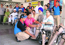 A patient gets an artificial limb at a camp in Ludhiana on Sunday.