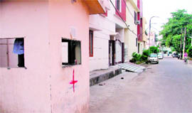 despite a cross sign put by the MC building squad on a structure, it has not been demolished.