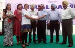 A student receiving award during the annual function of the Desh Bhagat Dental College in Muktsar