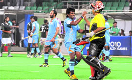 India team members celebrate after victory against Pakistan during Commonwealth Games match in New Delhi on Sunday.