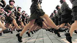 North Korean soldiers march during a military parade to commemorate the 65th anniversary of founding of the Workers' Party of Korea in Pyongyang on Sunday
