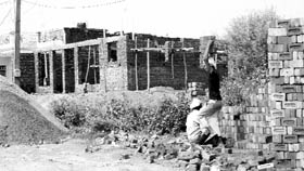 Unauthorised construction activity goes on at Akal Ashram Colony in Sohana on Monday.