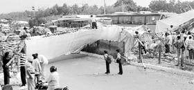 A temporary structure that collapsed at the Balongi barrier on the NH-21 in Kharar on Monday.
