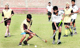 Players of SGGS Collegiate Public School, Sector 26, and Akal Sahib Academy, Baru Sahib, in action at the Hockey Stadium, Sector 18, Chandigarh, on Monday.