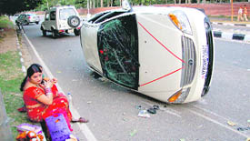 A car that overturned on the road separating Sectors 7 and 26 in Chandigarh.