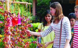 A foreigner checks out dolls at Dilli Haa