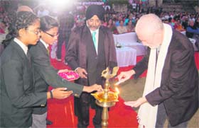 Actor Tom Alter lights the lamp at the founders day of Kasiga School in Dehradun on Sunday evening