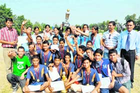 Members of SGRR Public School, Balawala, and SGRR Public School, Bhaniawala, teams pose with their trophies in Dehradun