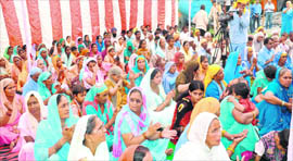 Devotees listen to Yogeshwar Pushpnandan Maharaj in Haridwar on Sunday.