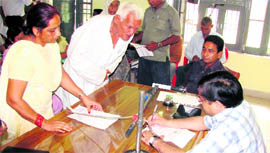 Deputy commissioner Vijay Singh Dahiya presides over an open darbar at Jakhal town, while Ashwani Maingi, SDM, Tohana, looks on.