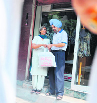 Brig KS Dhillon (retd.) and his wife outside their boutique in Ludhiana. 