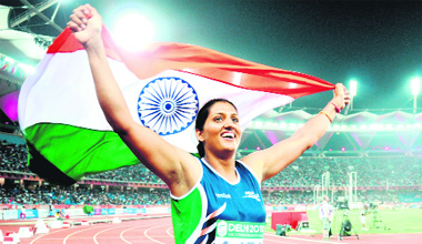 Krishna Ponia celebrates after winning the gold medal in discus throw.