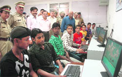 Students take computer lessons under the Pehla Kadam initiative of the Chandigarh Police at the Police Lines in Sector 26, Chandigarh, on Tuesday.