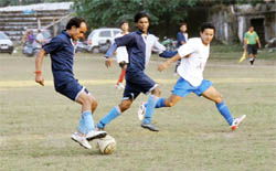 Players vie for the ball at a match of the DFA Challenger Cup at the Pavilion Ground in Dehradun on Tuesday.