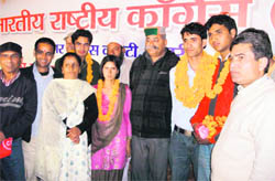 Mussoorie MLA Jot Singh Gunsola with the newly elected members of NSUI at MPG College in Mussoorie on Tuesday.