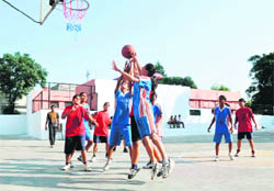 A match in the District Youth Under-16 Basketball Championship in progress in Dehradun on Tuesday.