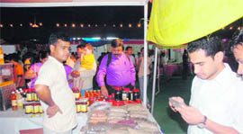 Customers have a look at an organic stall at the Saras Mela.
