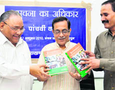 CIC RS Tolia (left) with VC of Doon University Girijesh Pant (middle) release a book in Dehradun on Tuesday.