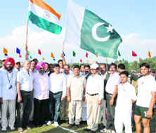 Indian and Pakistan flags waved before the start of a kabaddi match at Sujanpur.