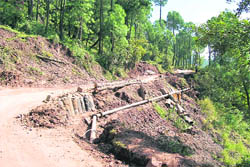 A patch of Kasauli-Jagjitnagar road that was damaged due to heavy rains