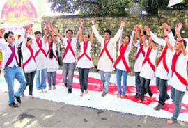 Students of Dronacharya BEd College enact a street play on AIDS in Dharamsala 