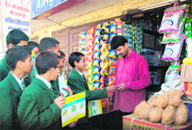 Students of BSN School guide shopkeepers at Chakkar during an eco-monitoring campaign in Shimla