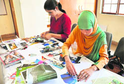 Students participate in a paper-cutting competition during the Display Your Talent contest in University of Jammu on Tuesday.