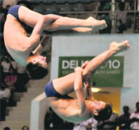 Tom Daley and Max Brick of England compete in the mens 10m synchro platfrom diving in New Delhi