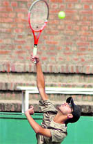 A player in action during a tennis match at the CLTA, Sector 10, Chandigarh, on Wednesday