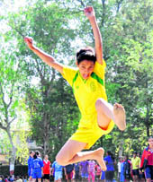 An athlete participates in long jump in the District-Level Sports Competition in Dehradun on Wednesday